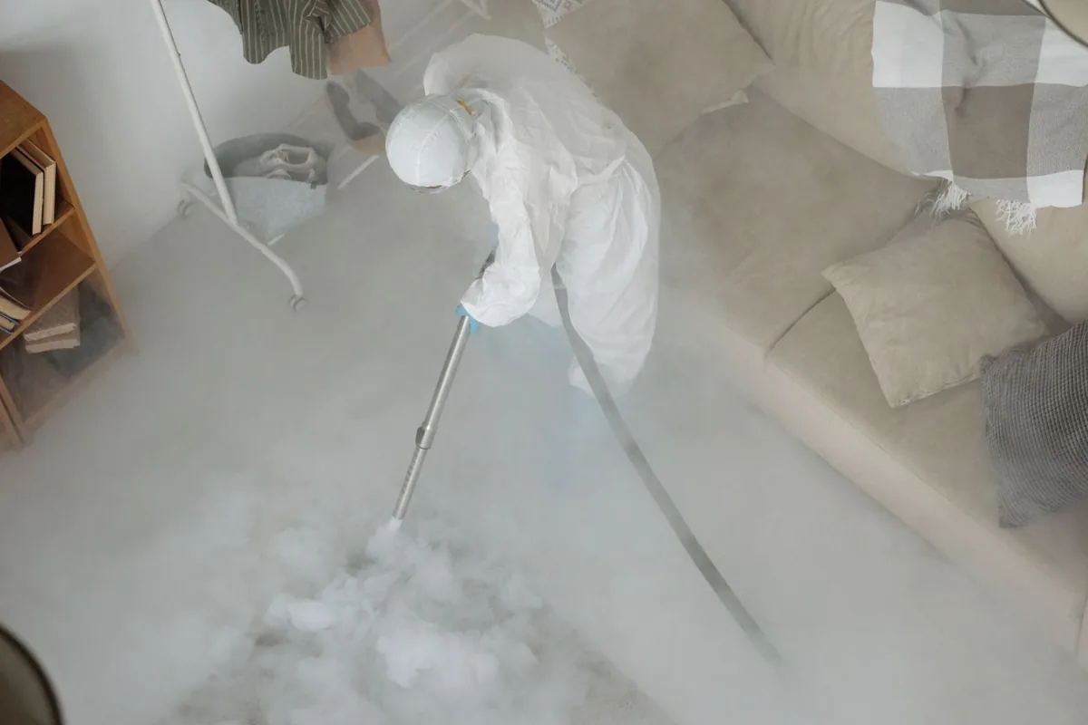 Biohazard cleanup technician in protective equipment, Reading, PA